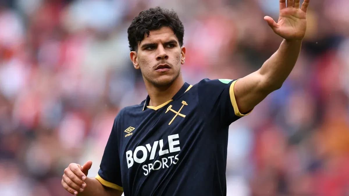 Player waving during a football match