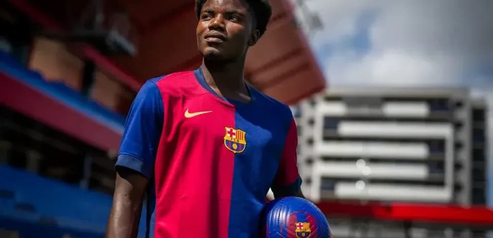Player holding a ball at Barcelona stadium
