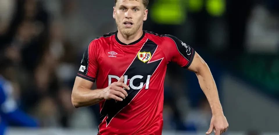 Player running on the field in red uniform