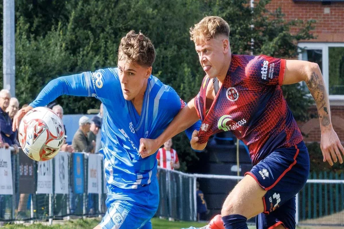 Two players competing for the ball during match