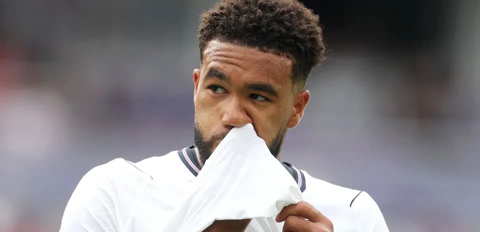 Player holding shirt to face during match