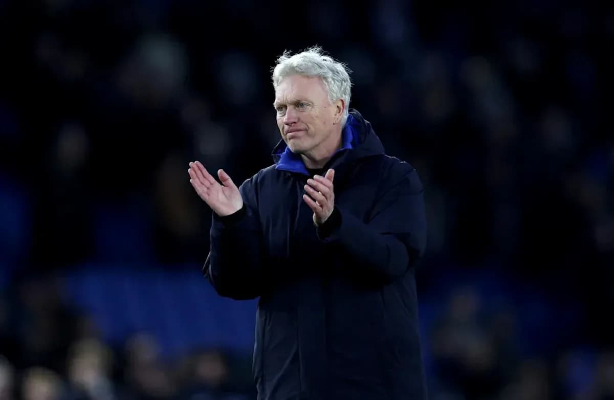 Manager clapping to the crowd after match