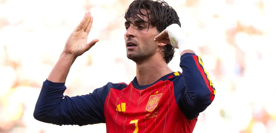 Player gesturing during match wearing Spain jersey