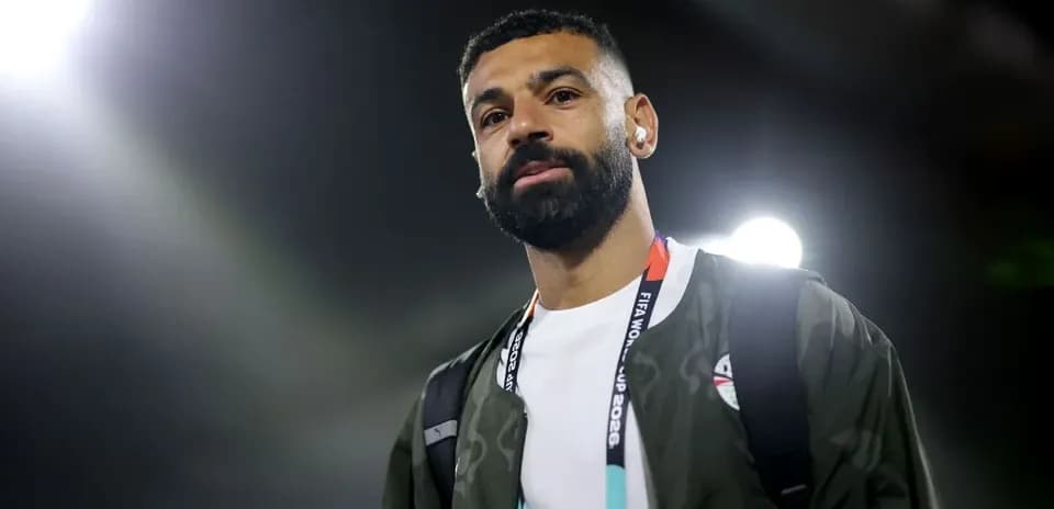 Player wearing headphones arriving at stadium