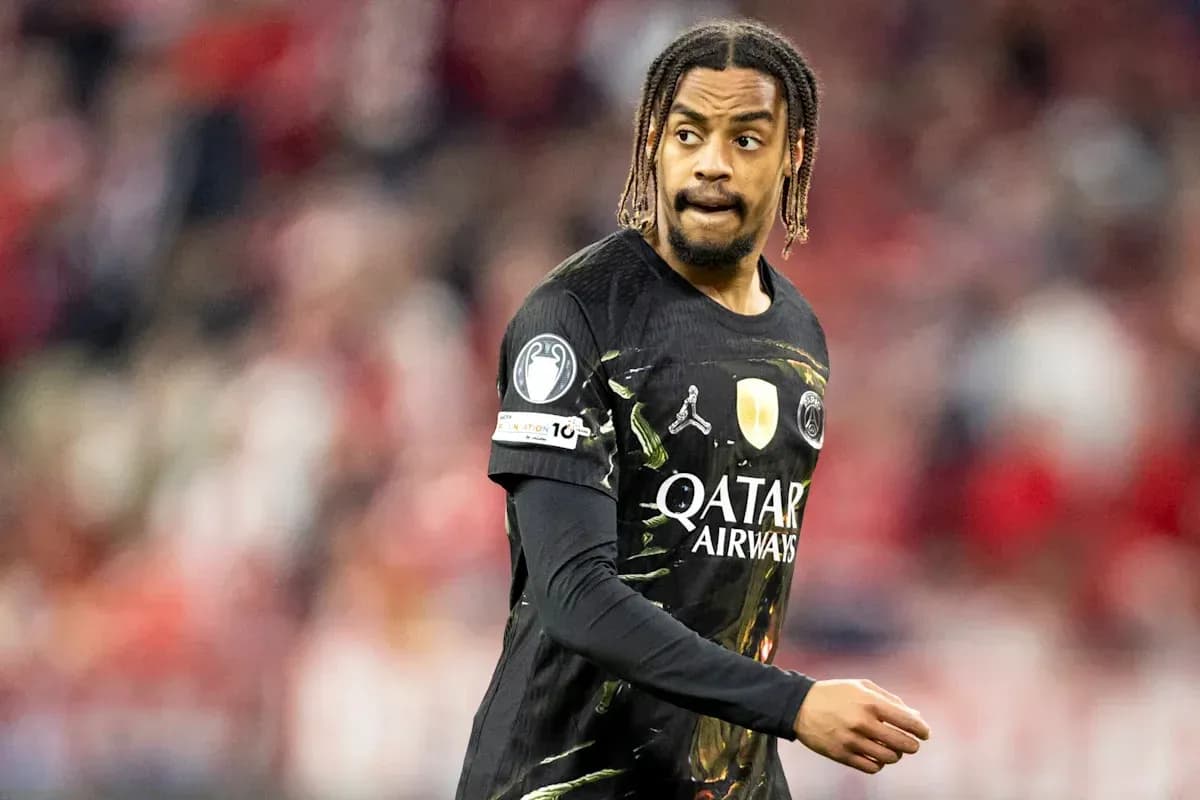 Player in black kit during football match