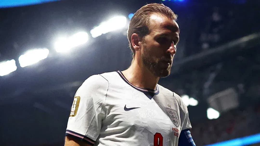 Player wearing England kit walking on the pitch