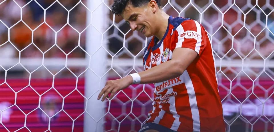 Chivas player celebrating near goalpost