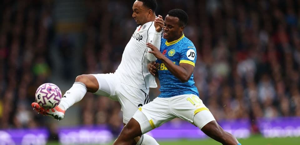Wolves and Fulham players battling for the ball