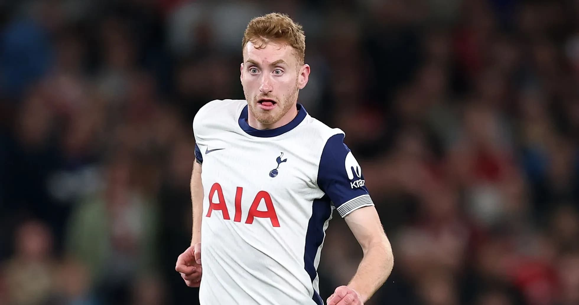 Player running on the pitch in Tottenham jersey
