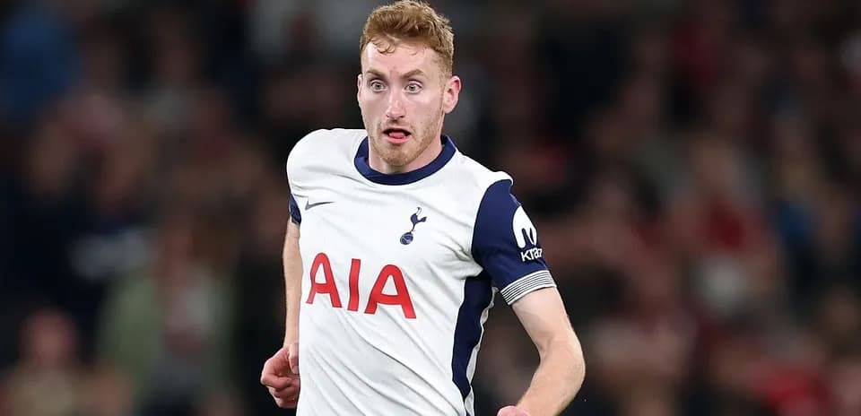 Player running on the pitch in Tottenham jersey