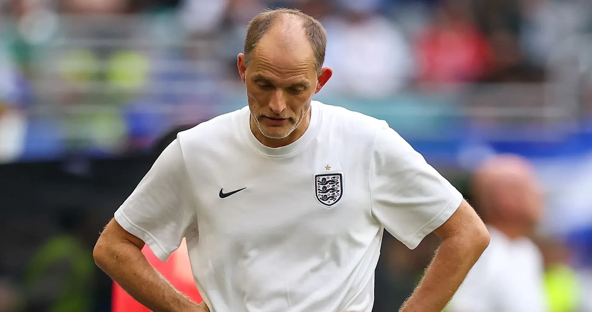 Coach with head down during match reflection