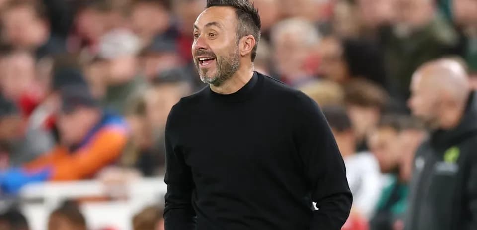 Coach gesturing during a match on the sidelines