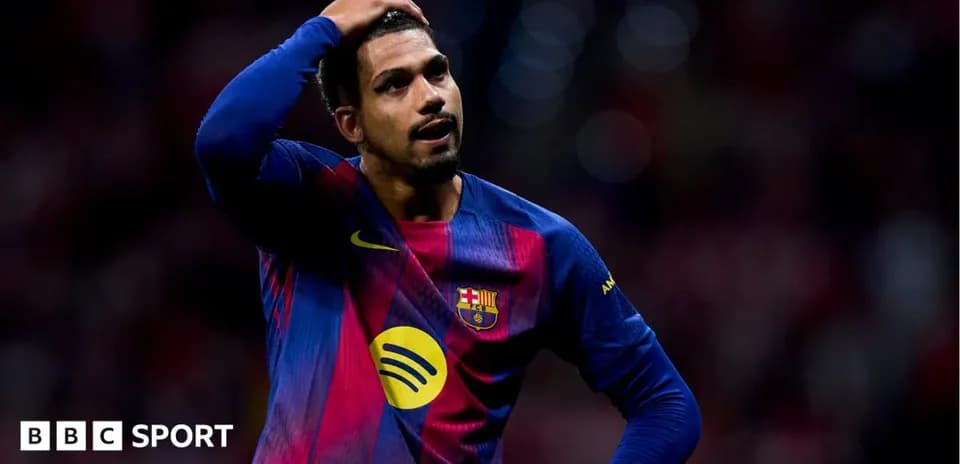 Player in Barcelona jersey looking frustrated on field