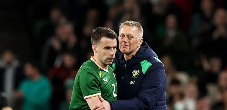 Player and coach embracing during a match