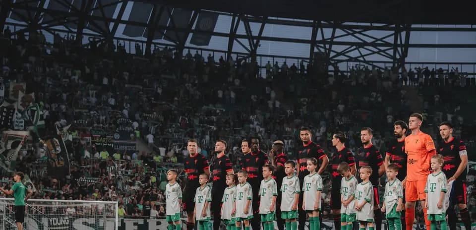 Players and children standing before the match