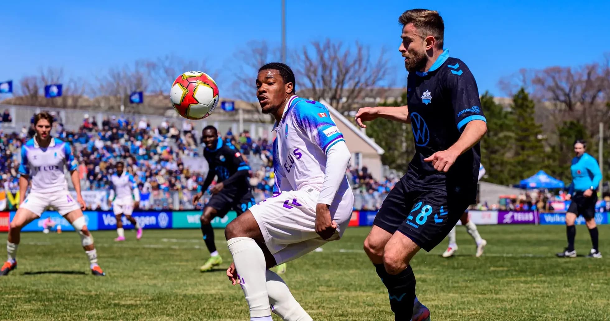 Players competing for the ball during match