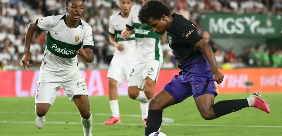 Player dribbling the ball during a football match