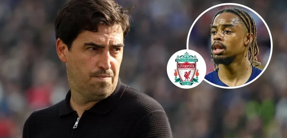Coach observing match with Liverpool logo and player image