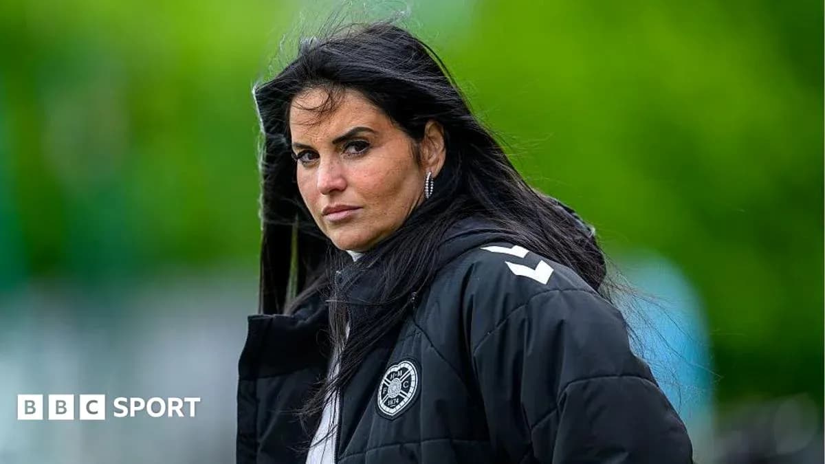 Coach observing training session with focused expression