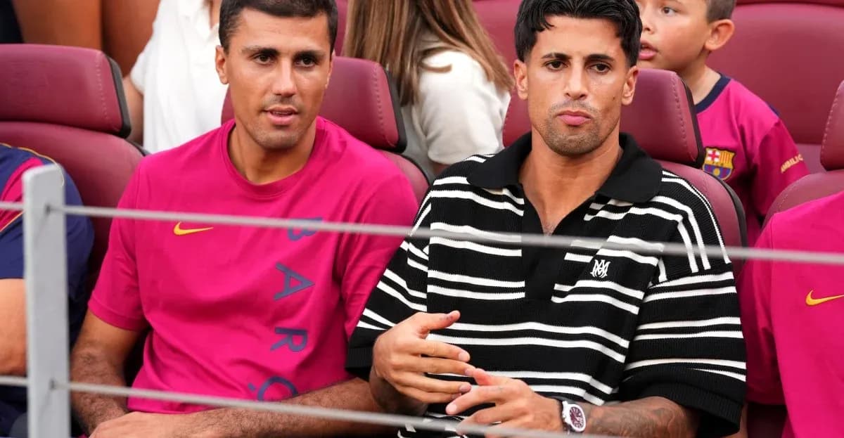 Two men seated in stadium during event