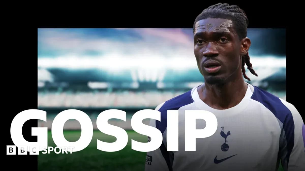 Football player wearing Tottenham jersey on field