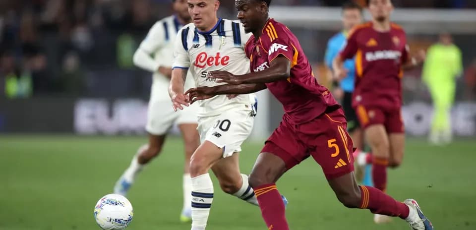 Players competing for the ball during Serie A match