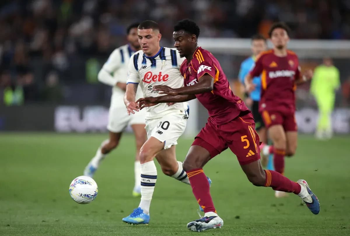 Players competing for the ball during Serie A match