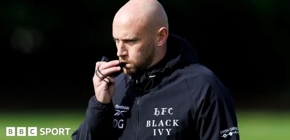 Coach blowing whistle during training session outdoors