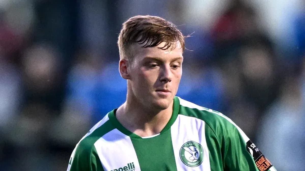 Player in green and white jersey during match