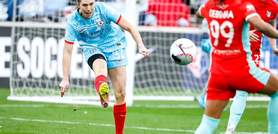 Chicago Red Stars player kicking the ball