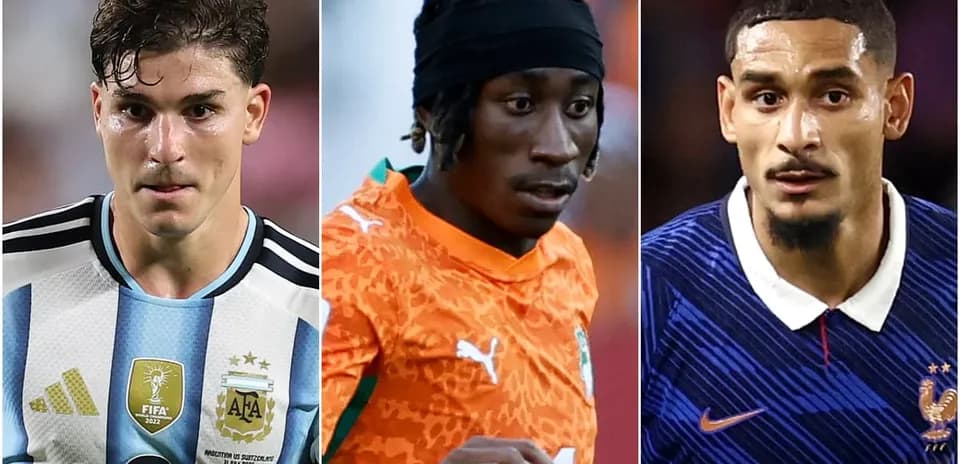 Three soccer players from different teams in action
