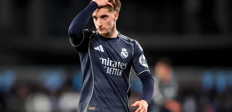 Player in Real Madrid kit walking off field