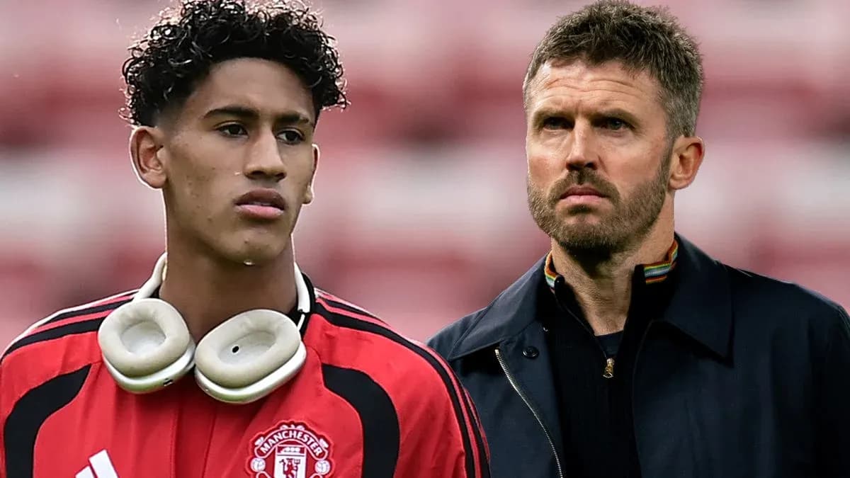 Young player in Manchester United kit with headphones