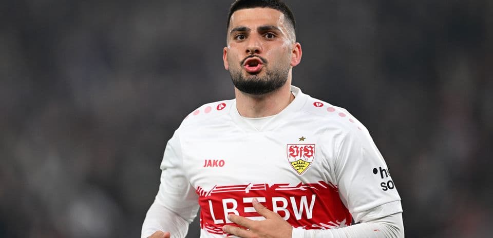 Player celebrating in Stuttgart home jersey during match