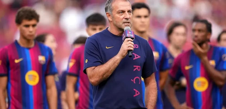 Coach speaking at Barcelona team presentation event