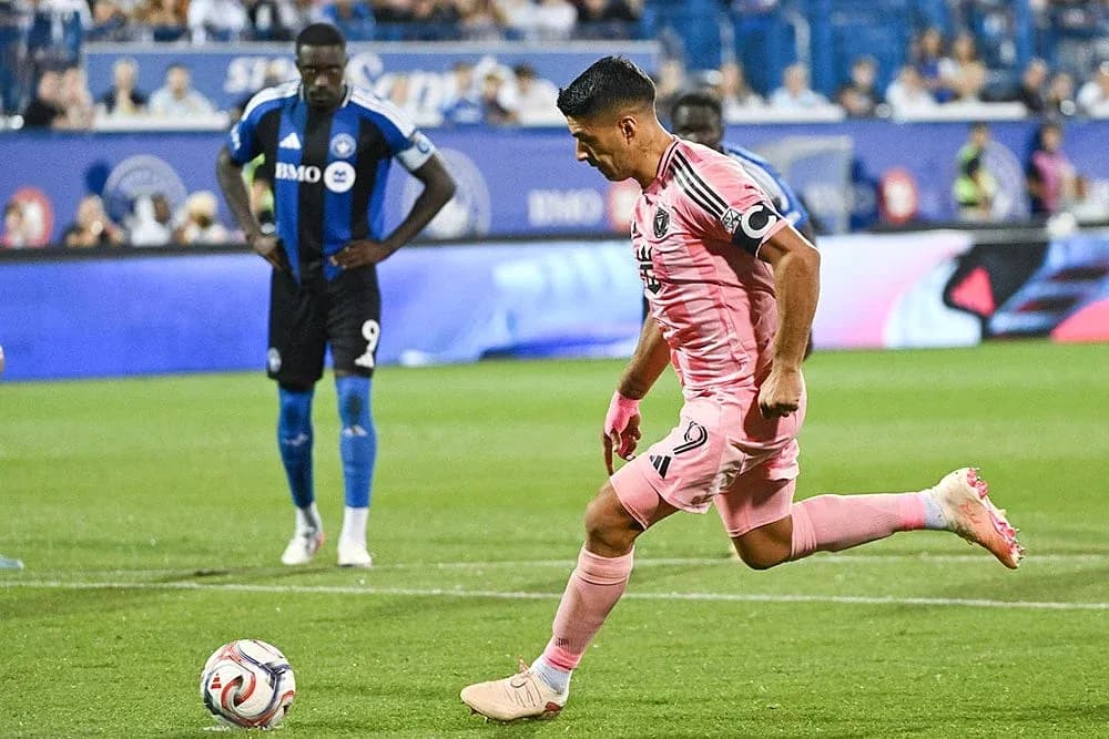 Player taking a penalty kick during match