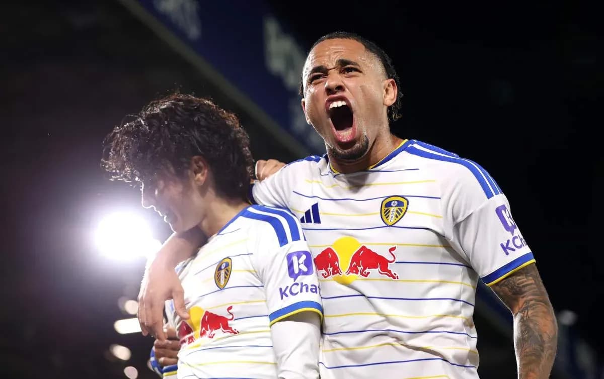 Two Leeds United players celebrating a goal