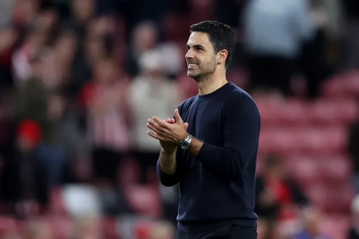 Manager applauding fans after the match