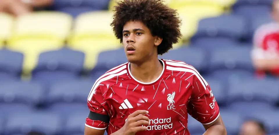 Player warming up in Liverpool kit before match