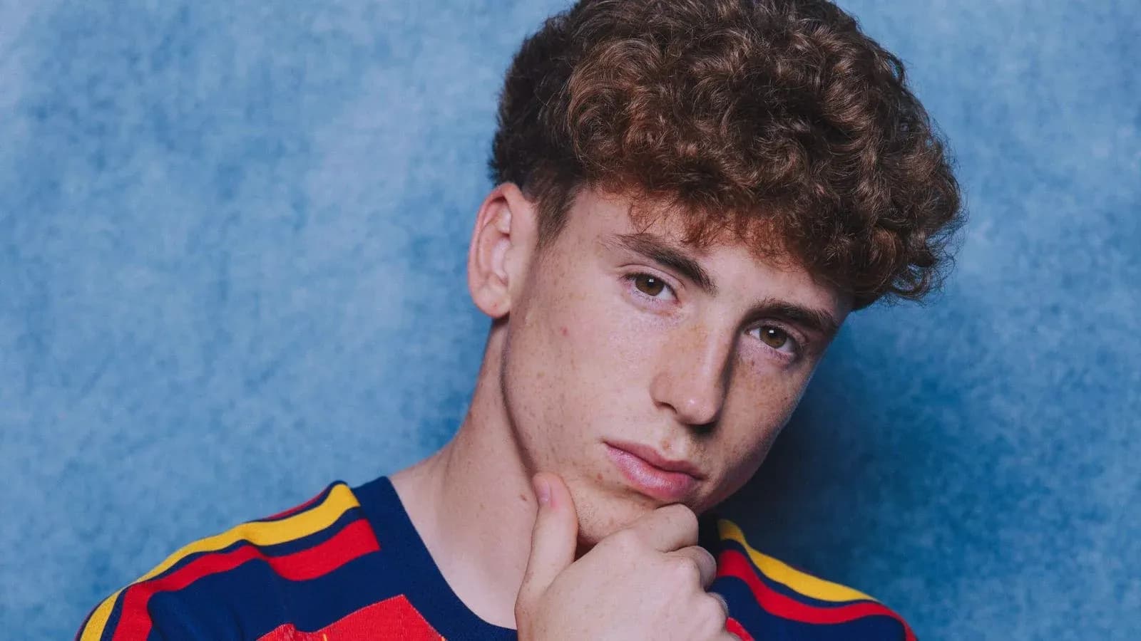 Young man posing with thoughtful expression