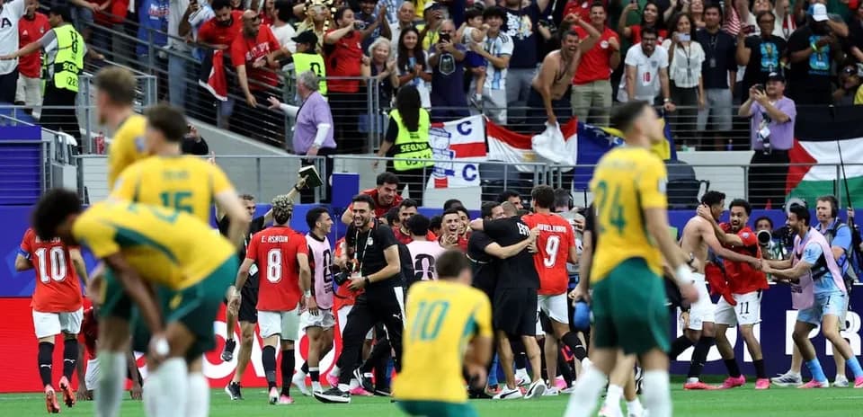 Players celebrating with fans after match conclusion