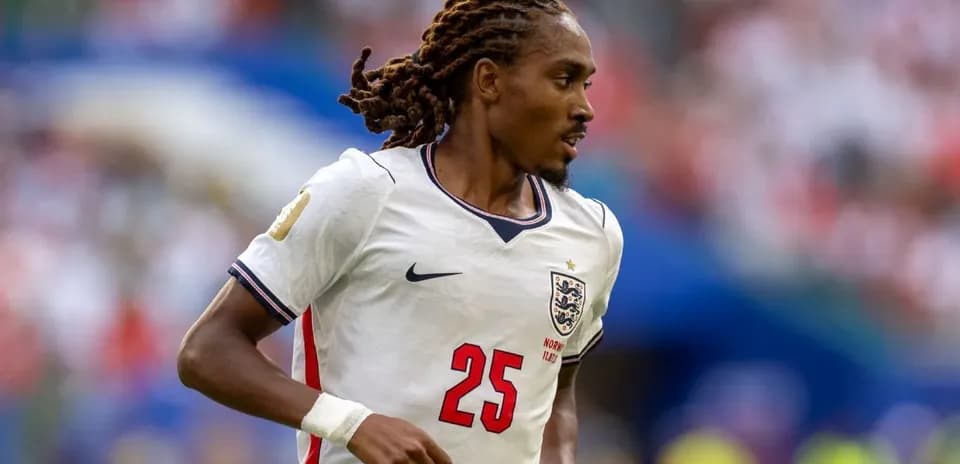Player wearing England jersey during football match