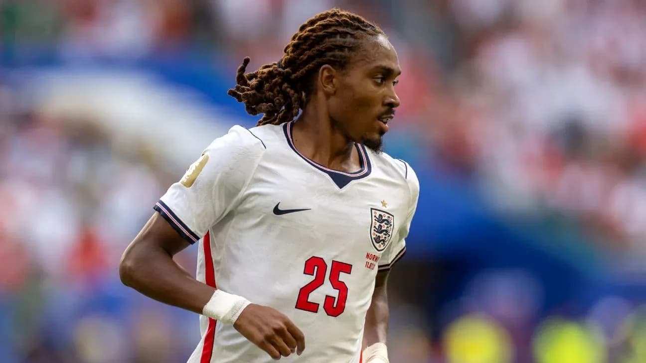 Player wearing England jersey during football match