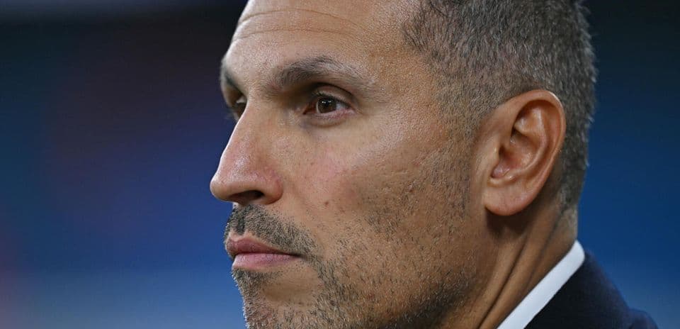 Close-up of a man with short hair and stubble