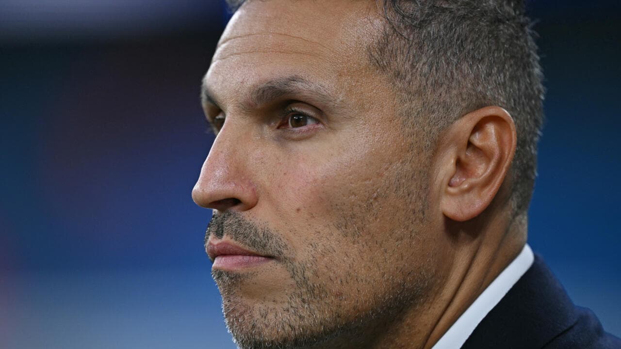 Close-up of a man with short hair and stubble