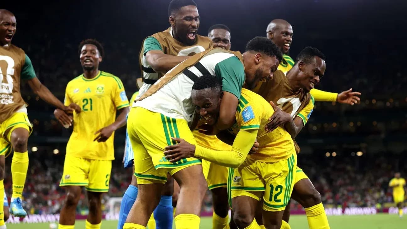 Players celebrating a goal in yellow jerseys