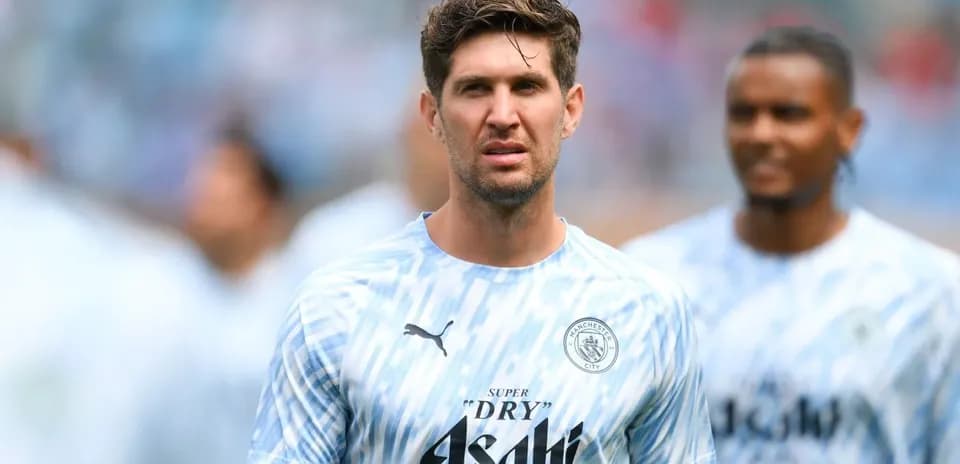 Player in Manchester City training kit on field