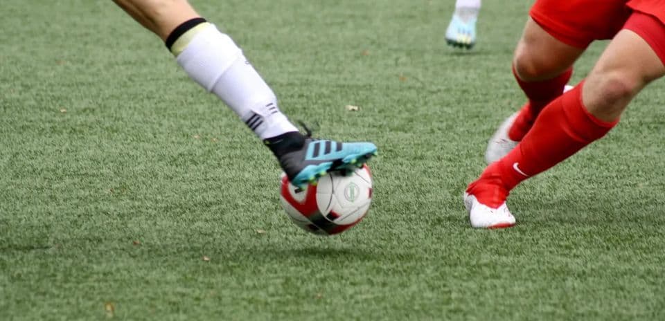 Players contesting for the ball during match