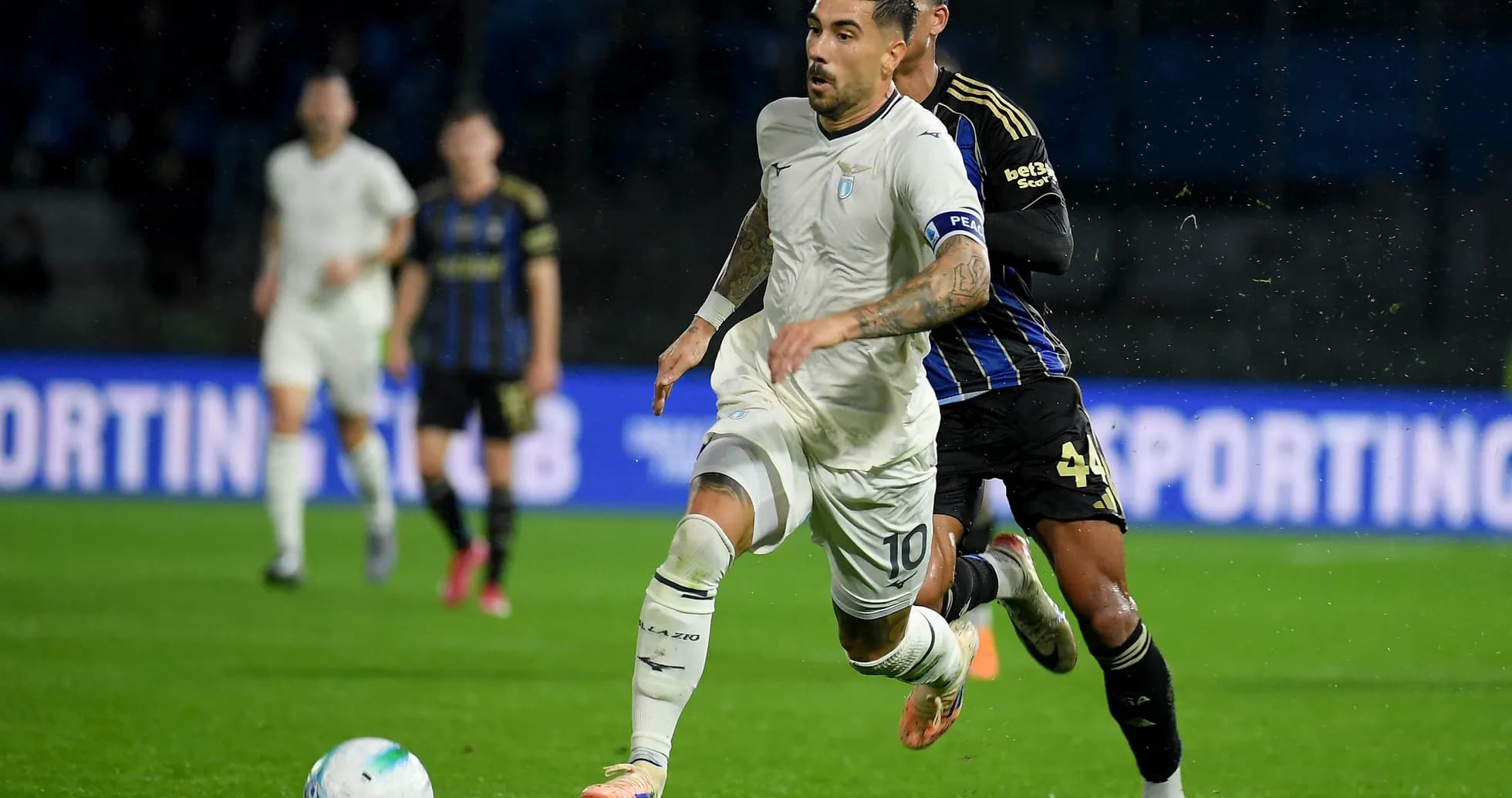 Lazio player running with ball during match
