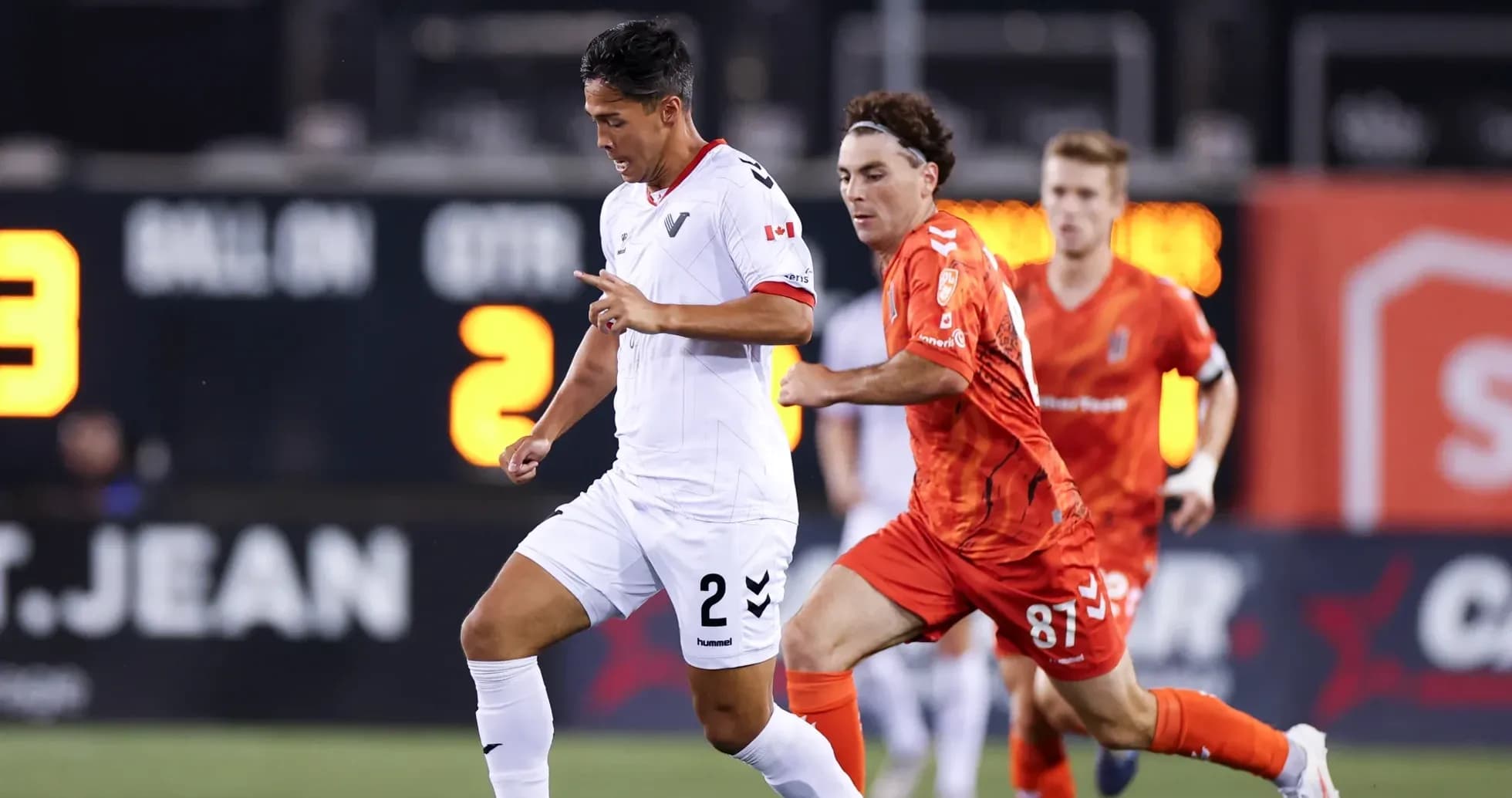 Player running with ball during match action